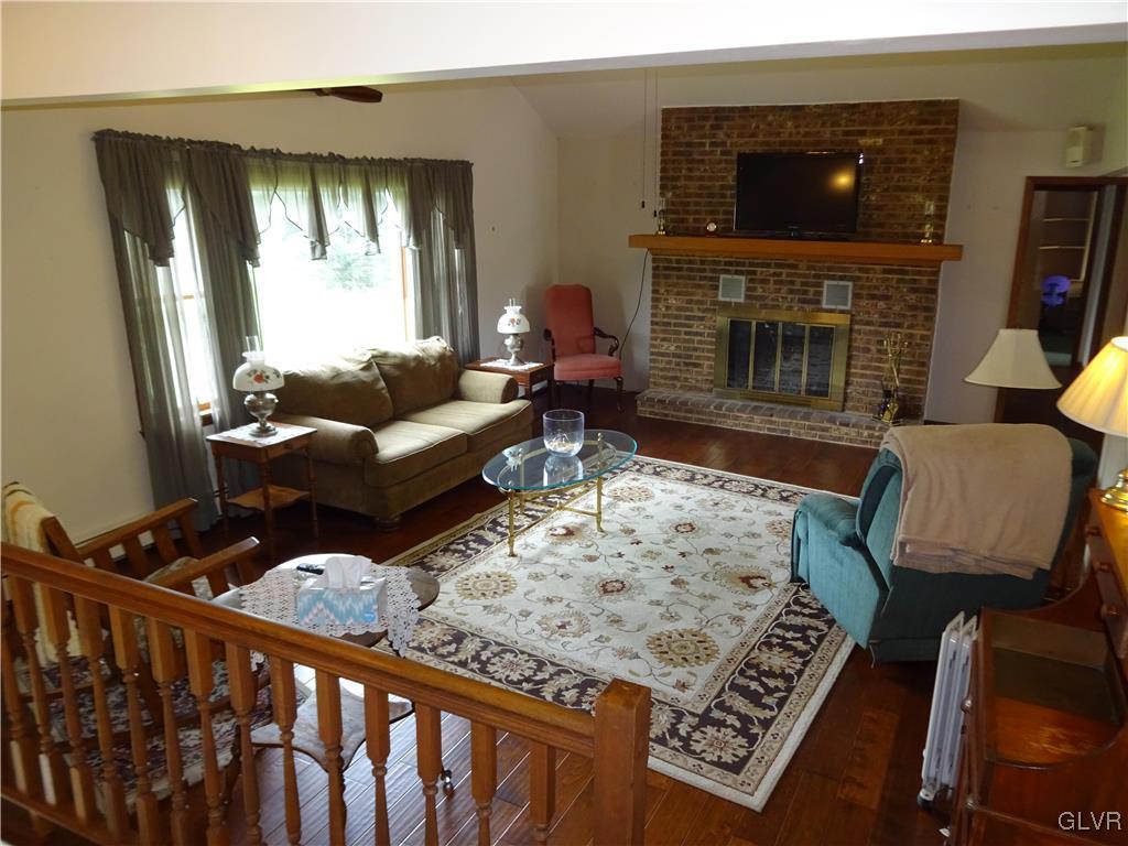 6808 Del Haven Road Bangor, PA 18013 - Photo 7 of 50 The living room w/fireplace and newer hand scraped