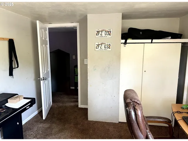 a view of a livingroom with furniture and a gym equipment