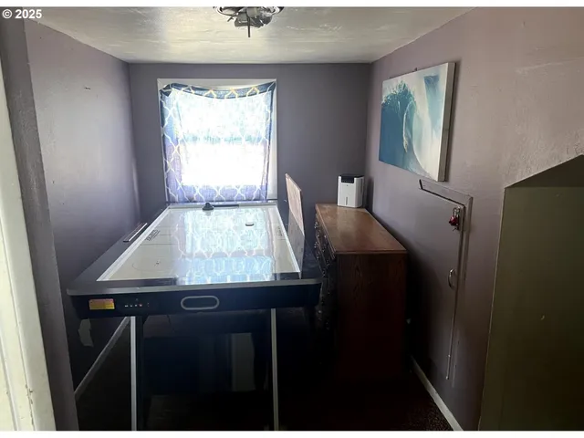 a dining room with a table and chairs