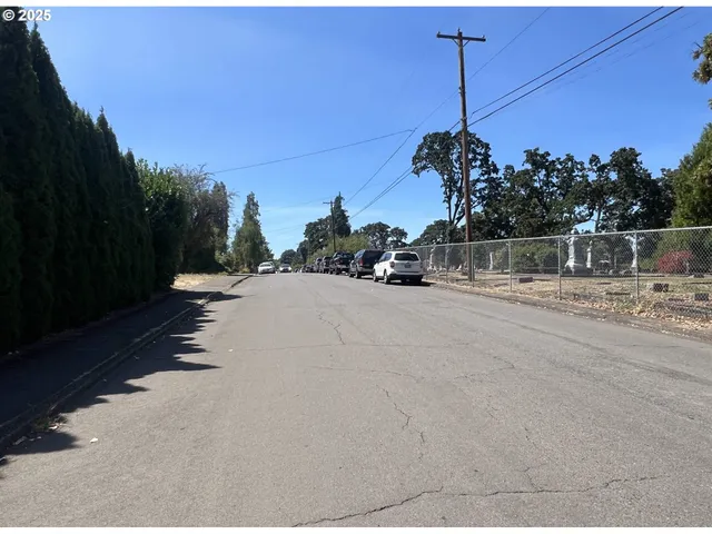 a water view of a house with a street