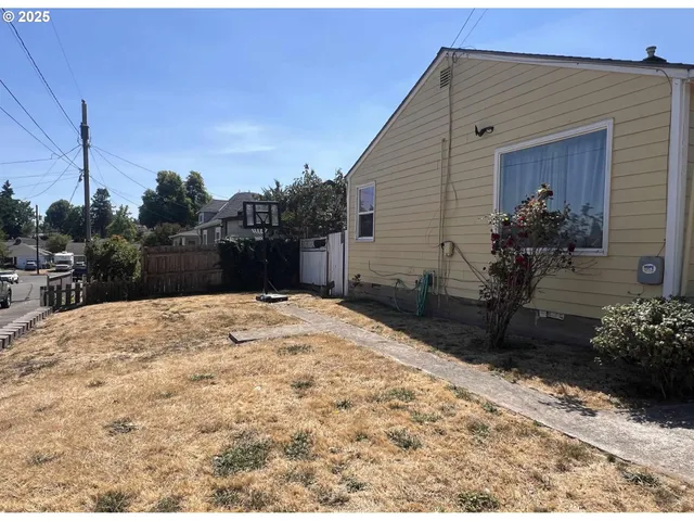 a view of a backyard of the house