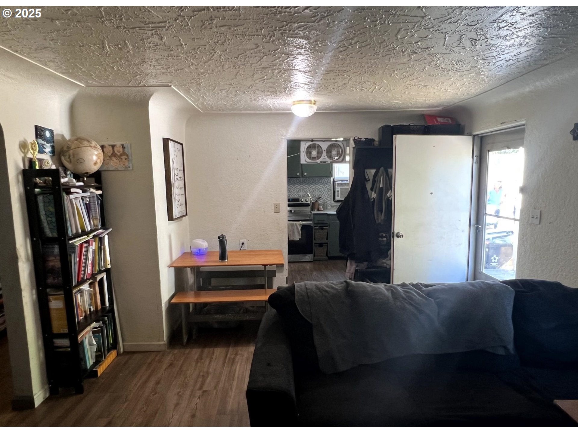 210 Hoyt Street Southeast Salem, OR 97302 - Photo 7 of 24 a bedroom with furniture and a book shelf