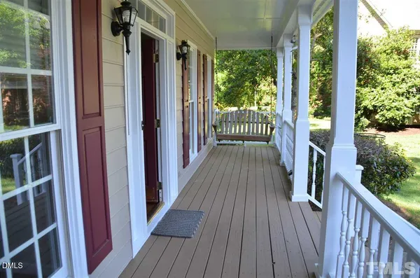 a view of balcony with wooden floor