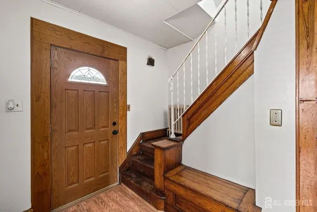 a view of entryway with wooden floor
