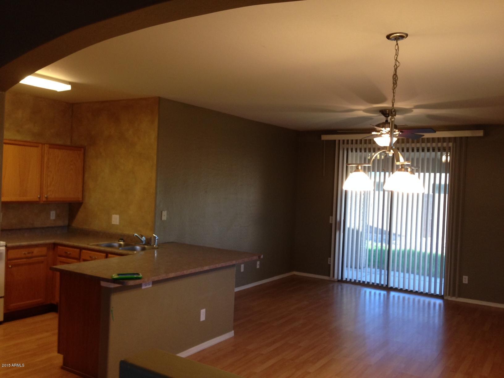 11202 West Berkeley Road Avondale, AZ 85392 - Photo 3 of 10 a kitchen with sink and window