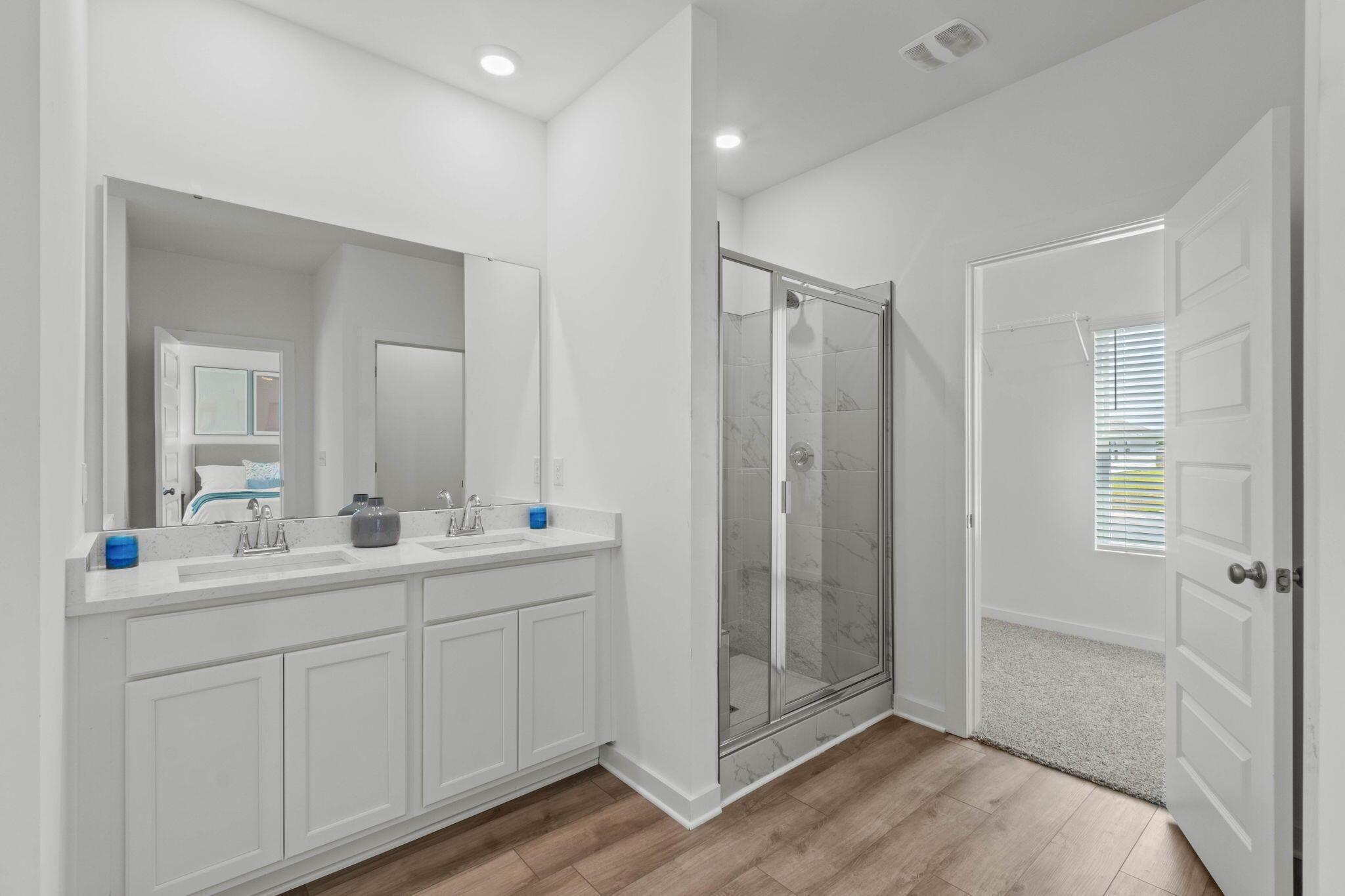 70 Parkside Street Freeport, FL 32439 - Photo 17 of 40 a bathroom with a double vanity sink and mirror