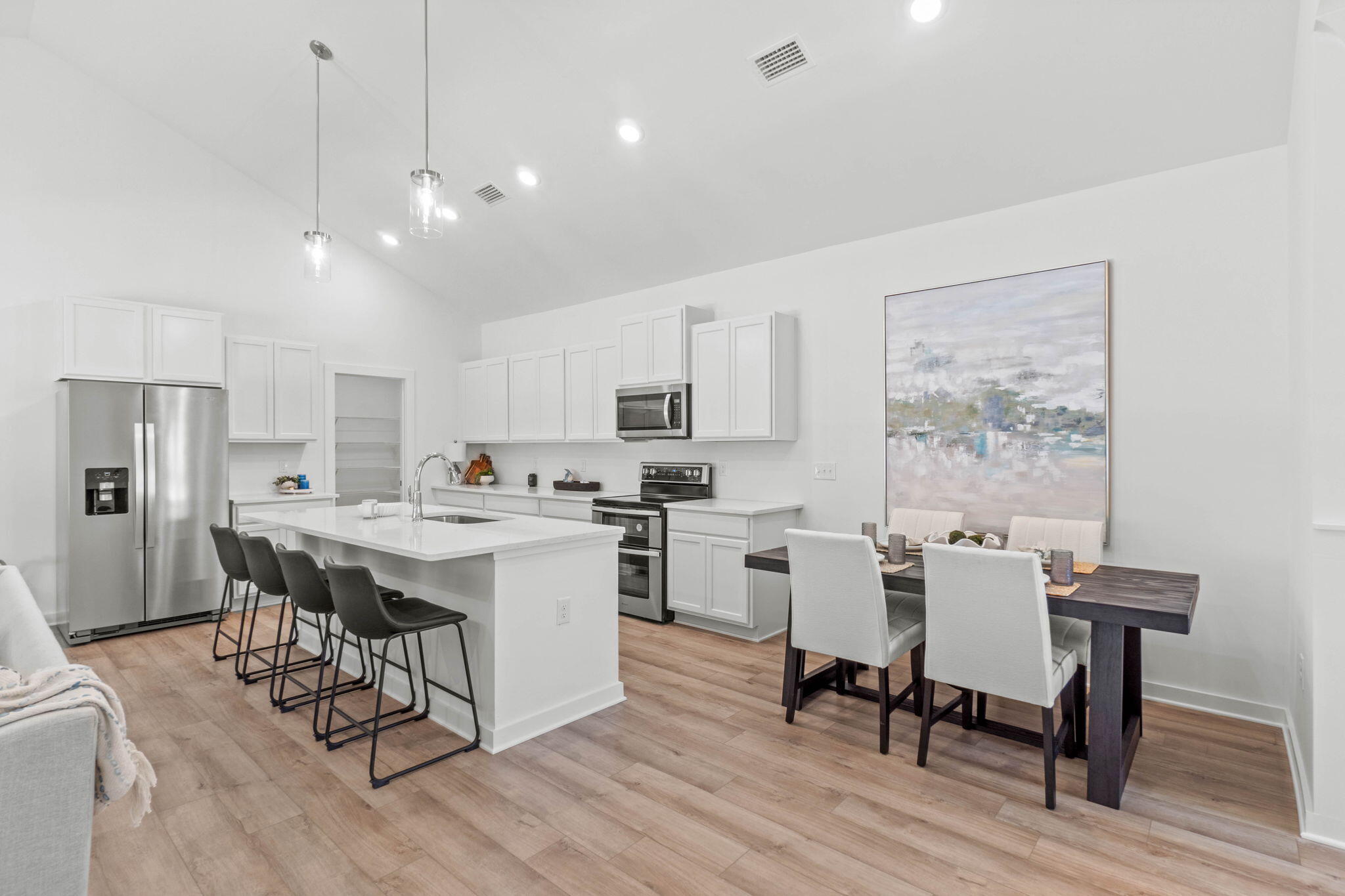 70 Parkside Street Freeport, FL 32439 - Photo 5 of 40 a large kitchen with a table and chairs in it