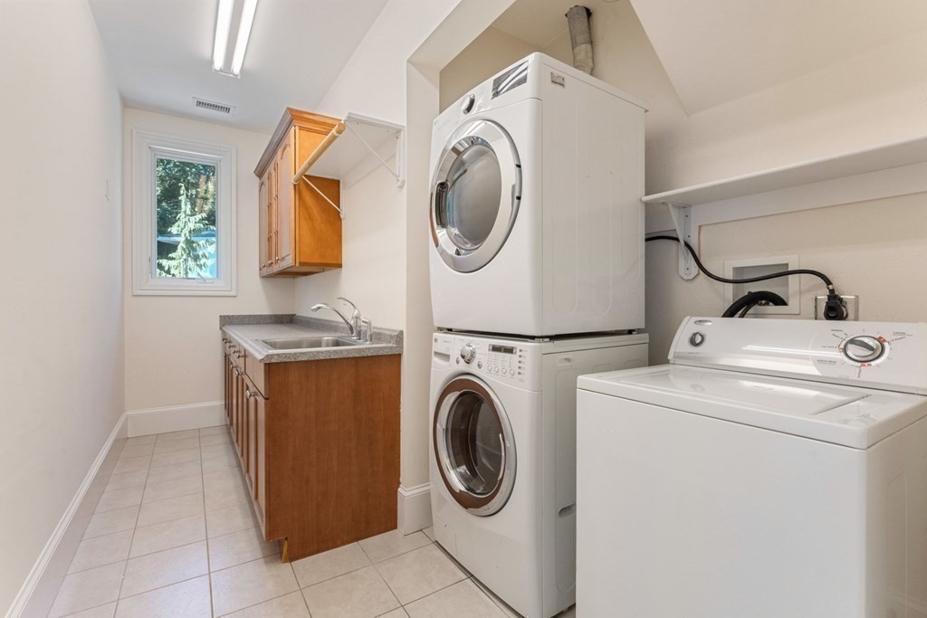14 Cottonwood Road Newton, MA 02459 - Photo 40 of 40 a utility room with dryer and washer