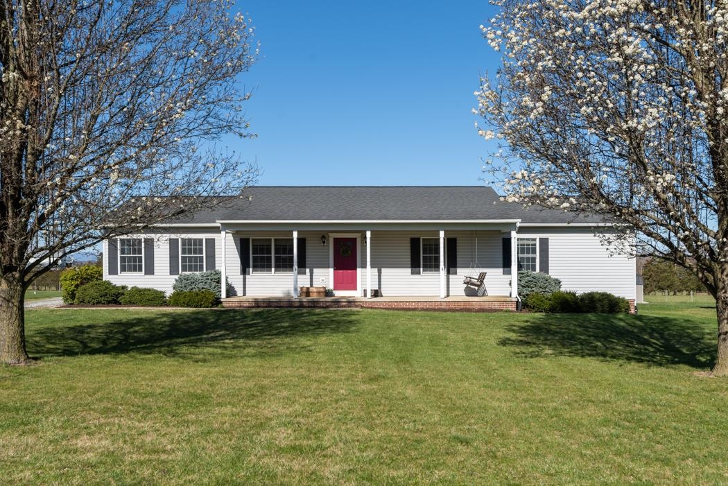 816 Battlefield Road Fort Defiance, VA 24437 - Photo 2 of 49 a front view of a house with a garden and trees