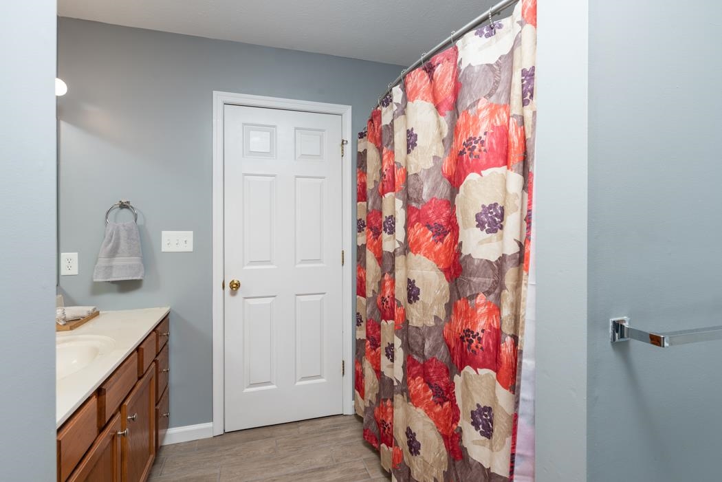 816 Battlefield Road Fort Defiance, VA 24437 - Photo 24 of 49 a bathroom with a sink and a shower curtain