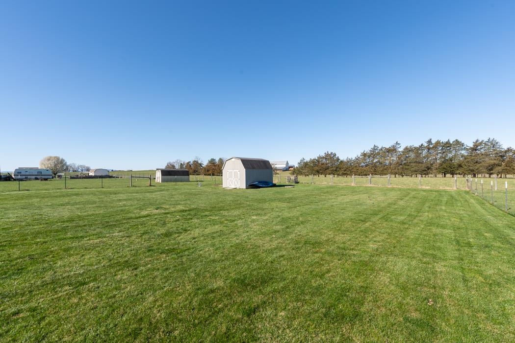 816 Battlefield Road Fort Defiance, VA 24437 - Photo 40 of 49 a backyard of a house with lots of green space and fog