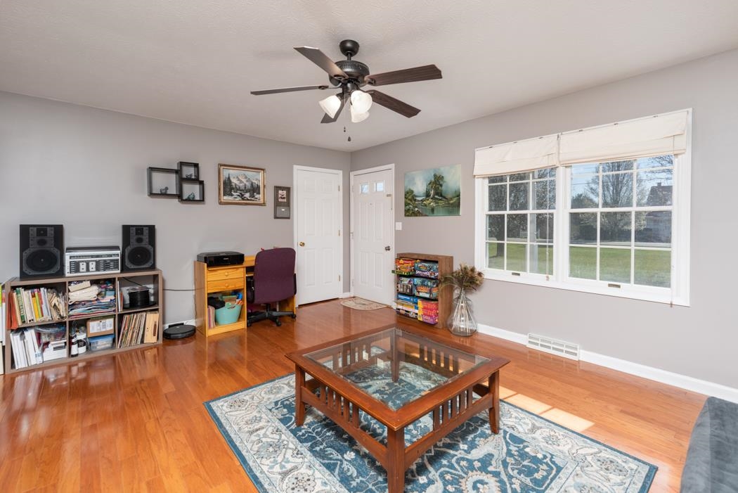 816 Battlefield Road Fort Defiance, VA 24437 - Photo 8 of 49 a living room with furniture a rug and a flat screen tv