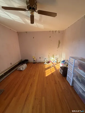 a kitchen with wooden floors and a sink