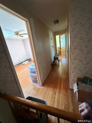 a bedroom with furniture and a chandelier
