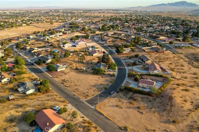 an aerial view of residential building and parking space