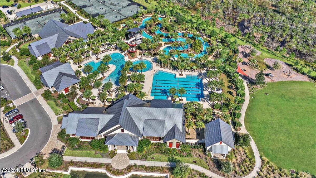 107 Crew Ct Street St. Augustine, FL 32092 - Photo 25 of 31 an aerial view of a house with a garden and trees