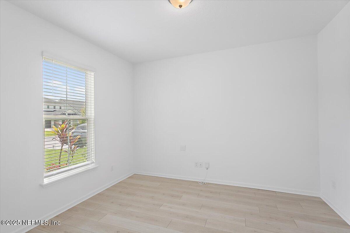 107 Crew Ct Street St. Augustine, FL 32092 - Photo 4 of 31 an empty room with windows