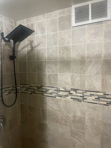 a view of balcony with wooden floor