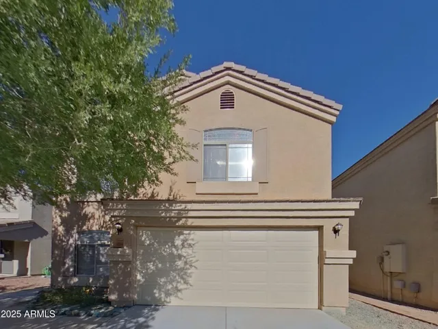 a view of the house with a tree