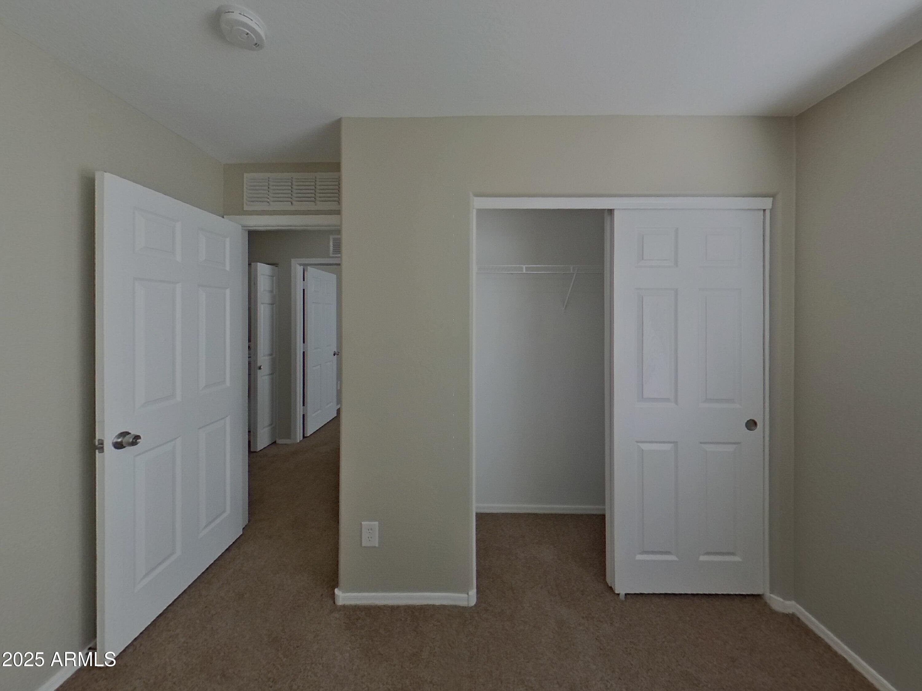 43846 West Magnolia Road Maricopa, AZ 85138 - Photo 10 of 18 an empty room with closet