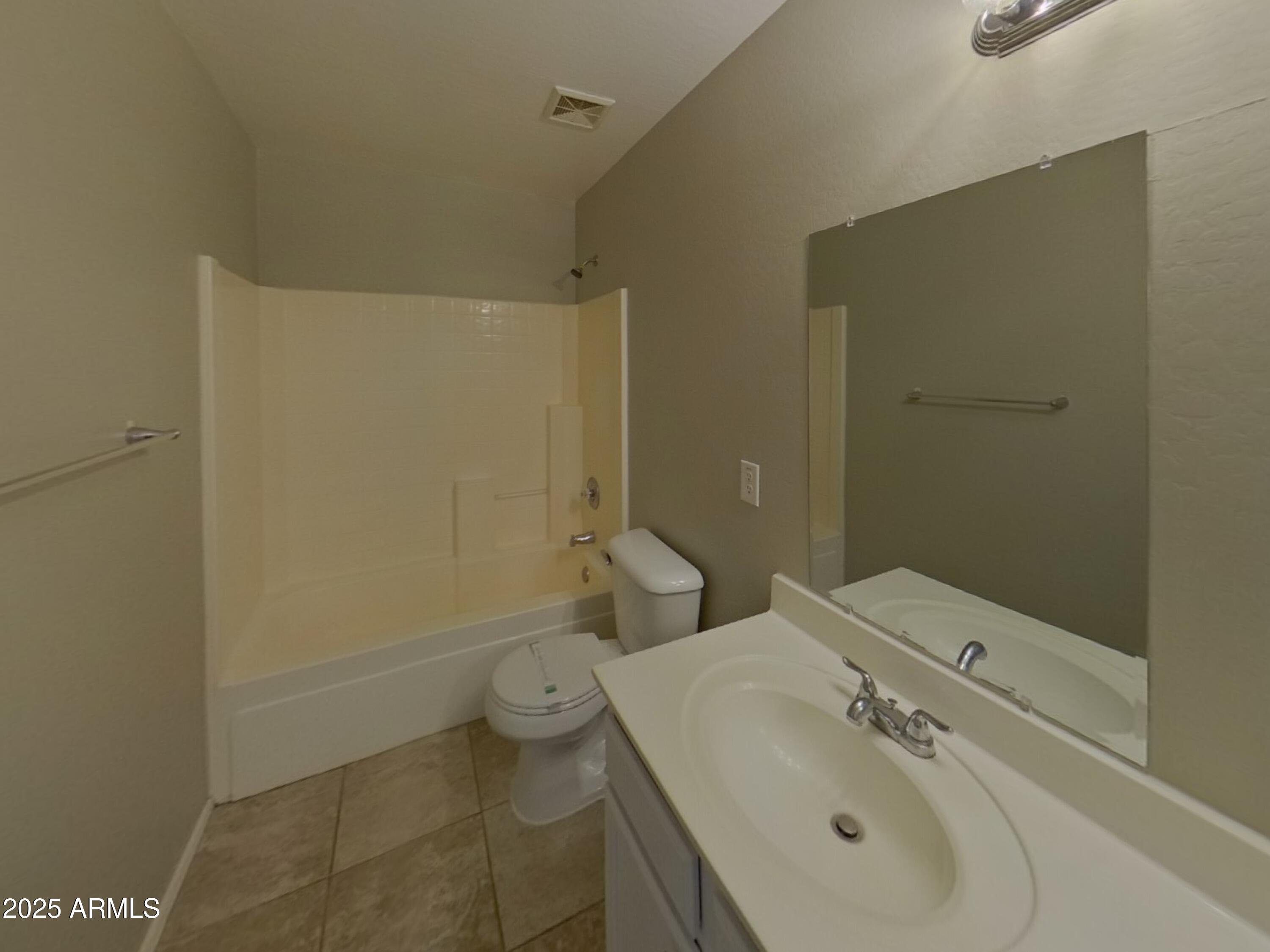 43846 West Magnolia Road Maricopa, AZ 85138 - Photo 14 of 18 a bathroom with a sink and mirror with toilet