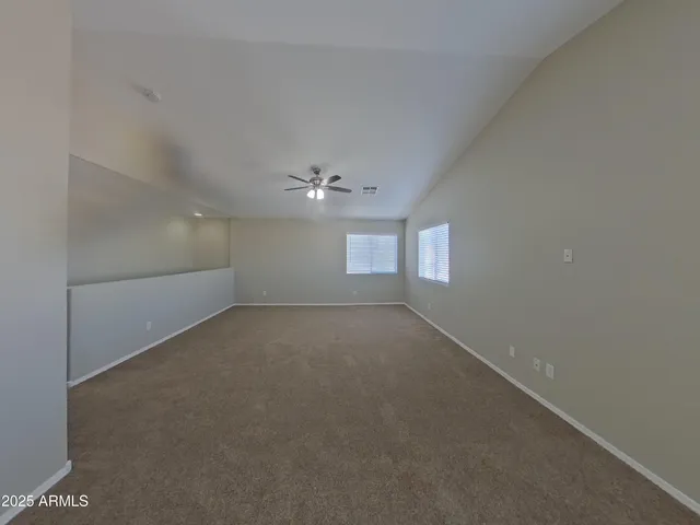a bathroom with a sink and mirror with toilet