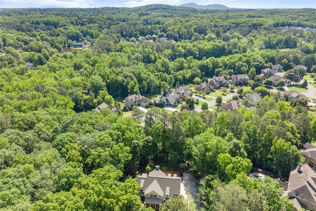 1450 Acworth Due West Road Northwest Kennesaw, GA 30152 - Photo 77 of 77 an aerial view of a house with a yard and couple of houses