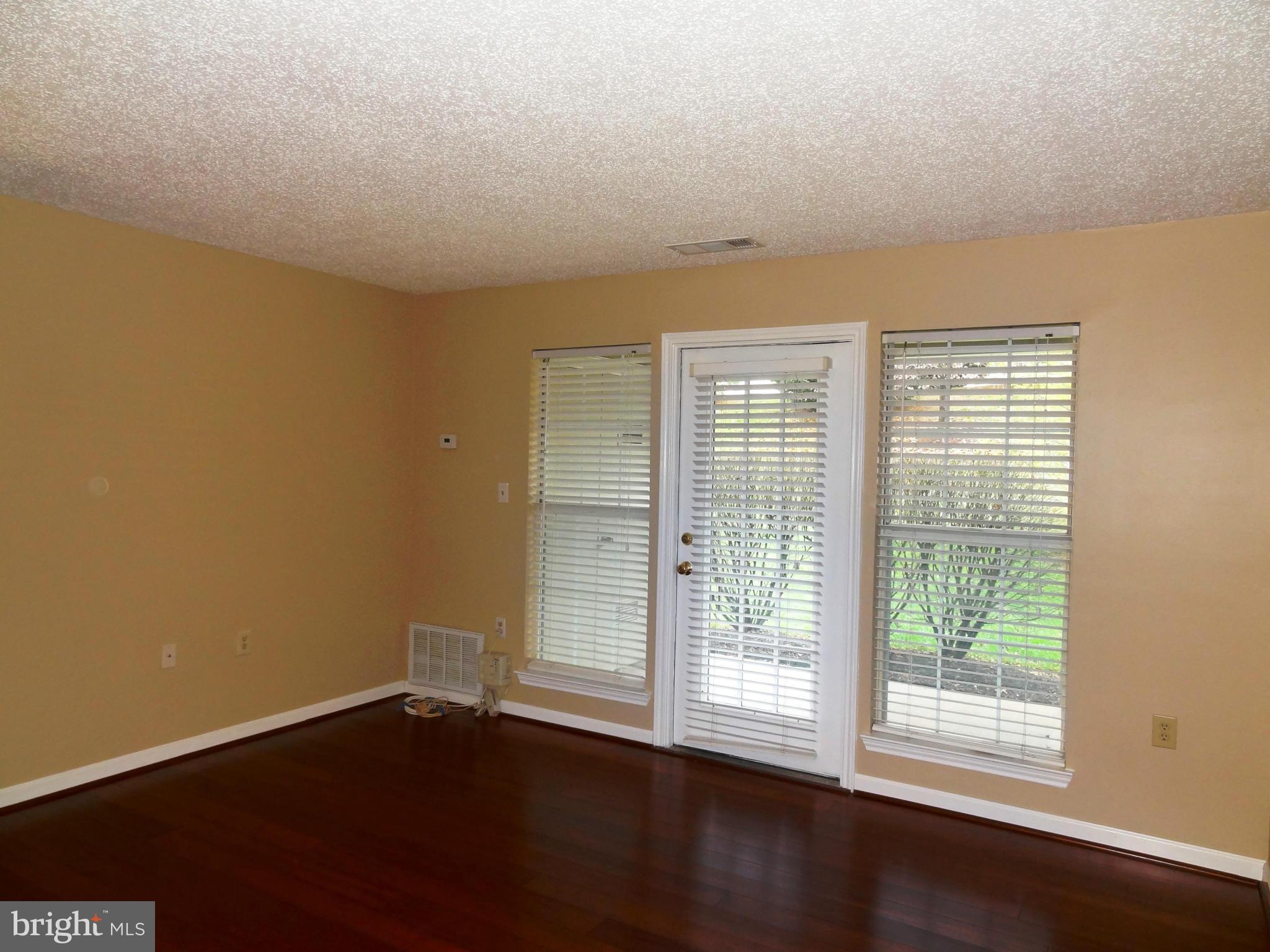 21026 Timber Ridge Terrace, Unit 103 Ashburn, VA 20147 - Photo 3 of 16 Living Room