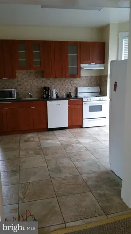 a bathroom with a toilet and shower