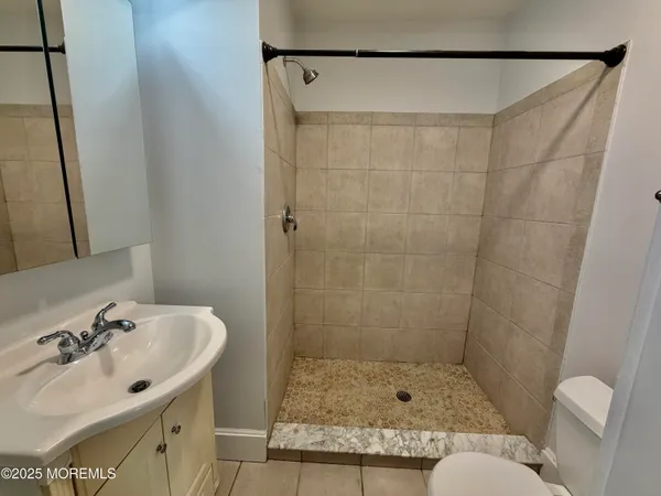 a bathroom with a sink and mirror