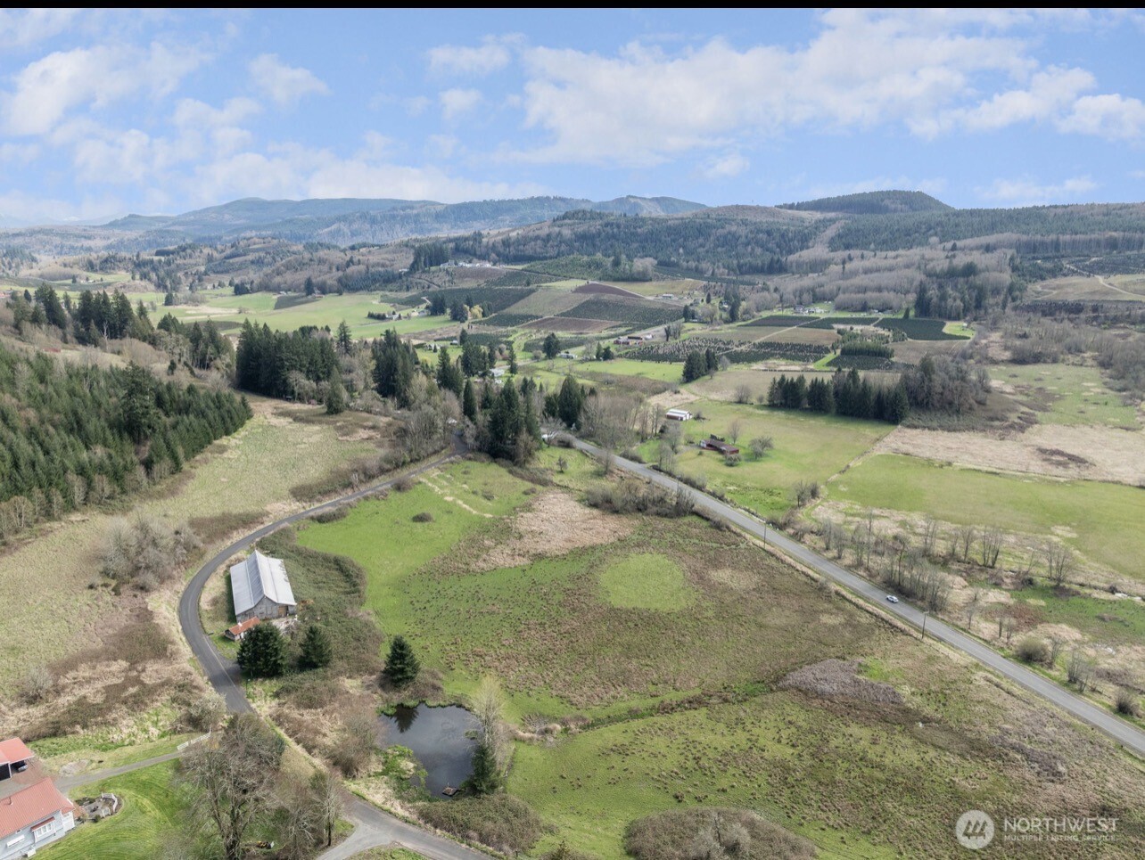 284 Jarvis Road Mossyrock, WA 98564 - Photo 3 of 6 an aerial view of a house with a yard