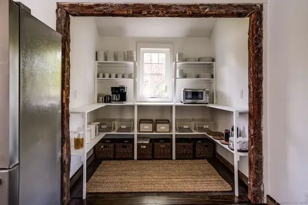 a living room with furniture a rug and a chandelier