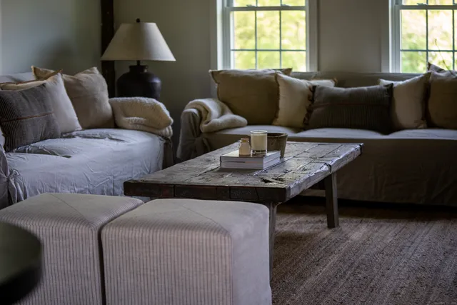 a bathroom with a toilet a sink and a mirror