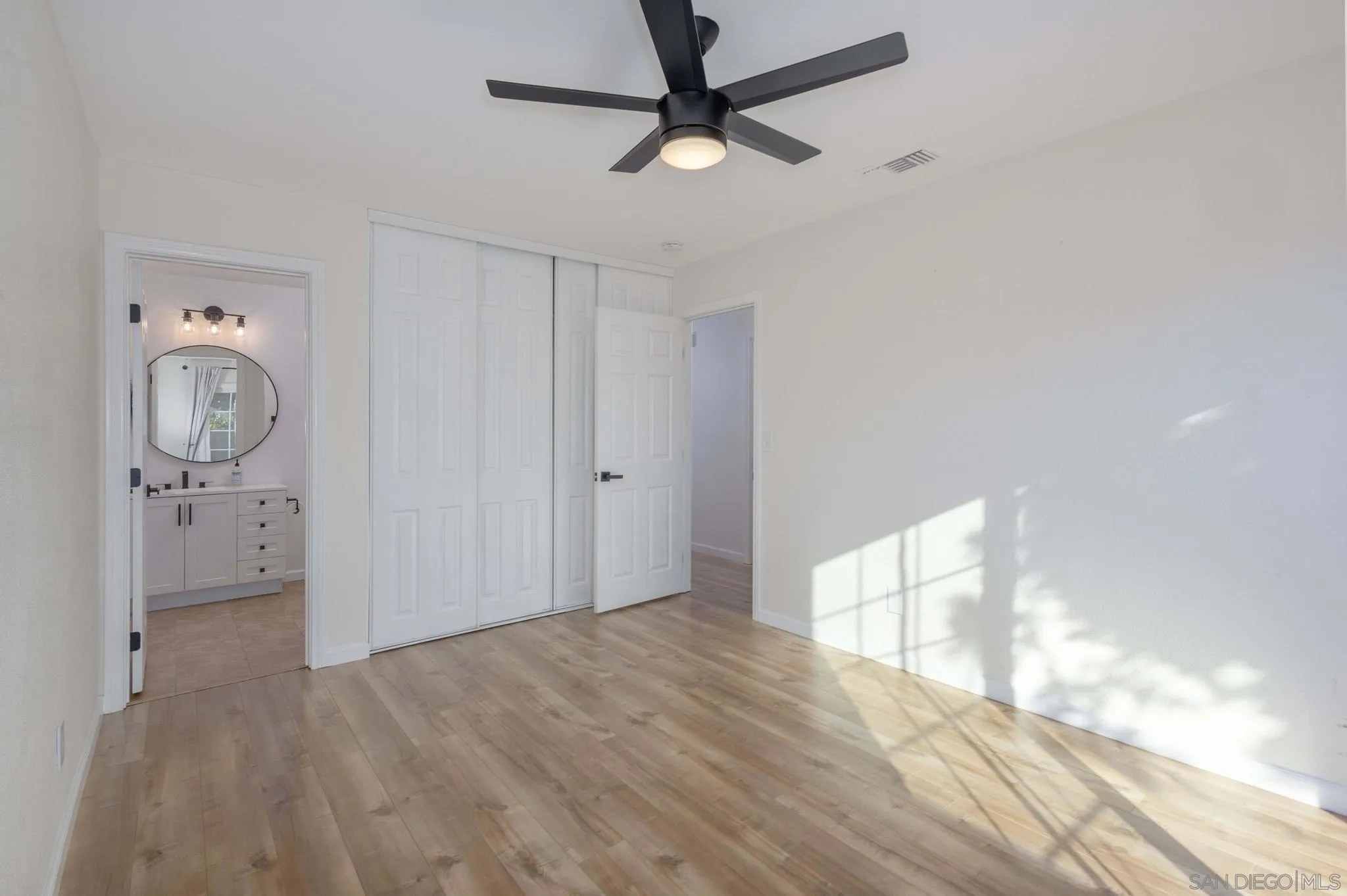 4733 Dalea Place Oceanside, CA 92057 - Photo 20 of 30 a view of empty room with wooden floor