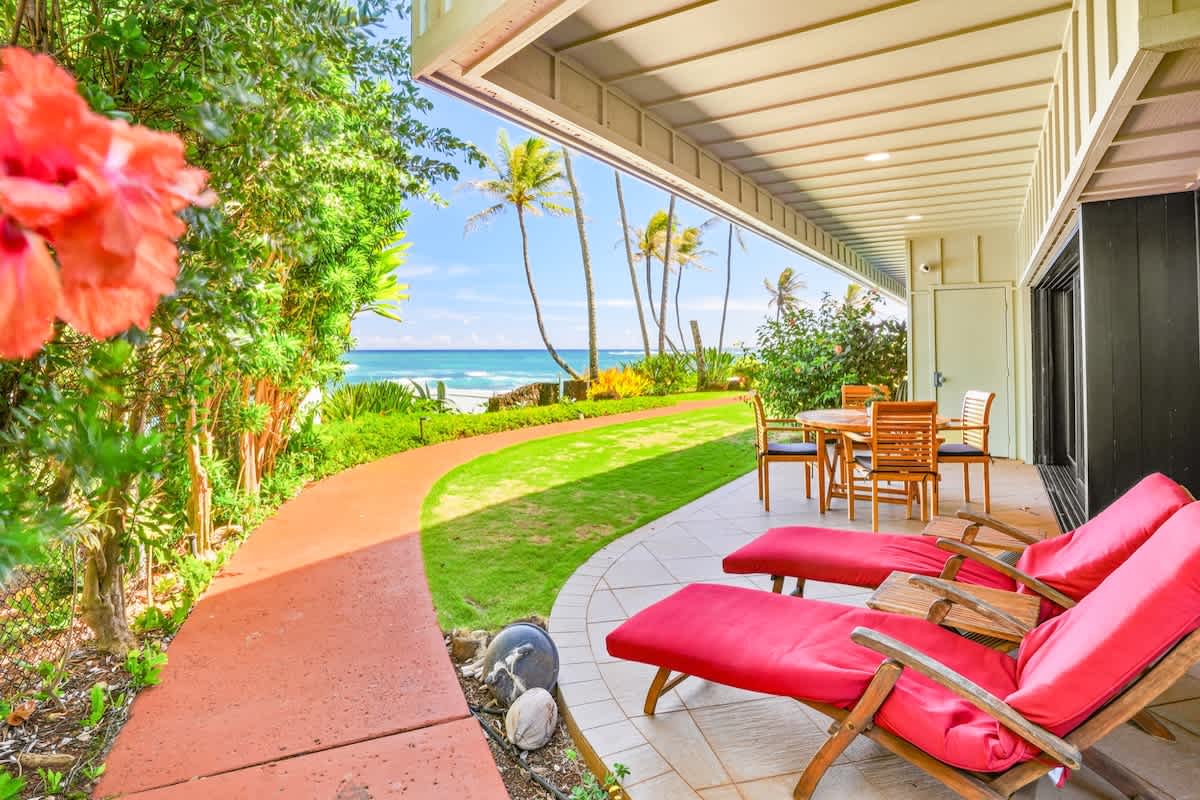 366 Papaloa Road, Unit 114 Kapaa, HI 96746 - Photo 14 of 23 a view of a patio with table and chairs and potted plants
