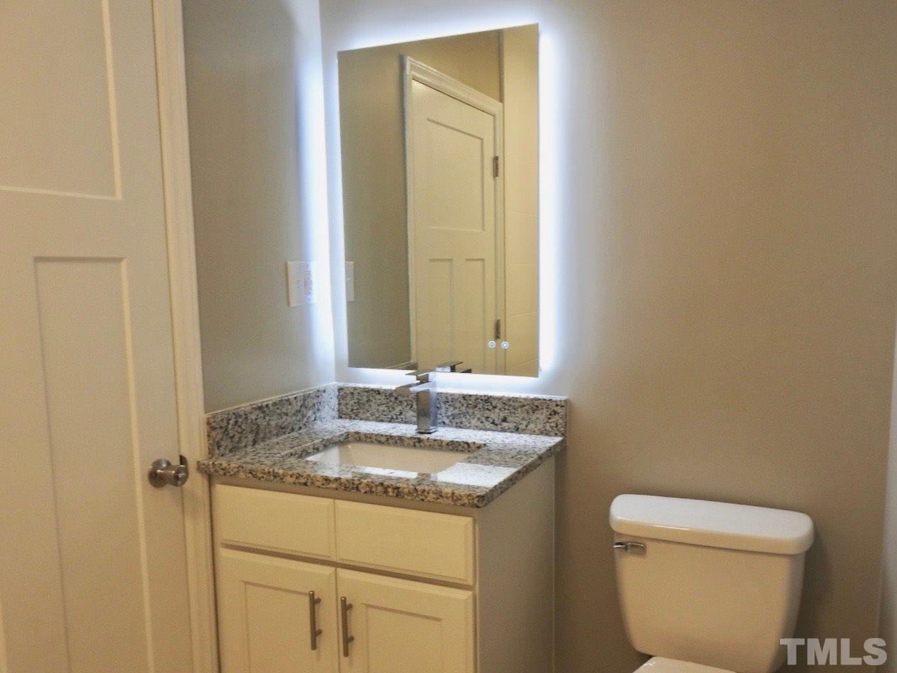 41 Peace Street Roxboro, NC 27573 - Photo 12 of 20 a bathroom with a sink and a toilet
