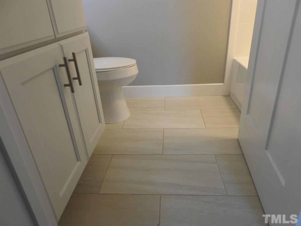 41 Peace Street Roxboro, NC 27573 - Photo 13 of 20 a bathroom with a sink and a toilet