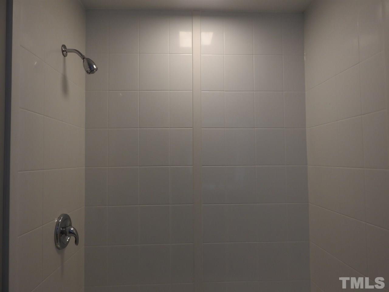 41 Peace Street Roxboro, NC 27573 - Photo 14 of 20 a bathroom with a shower
