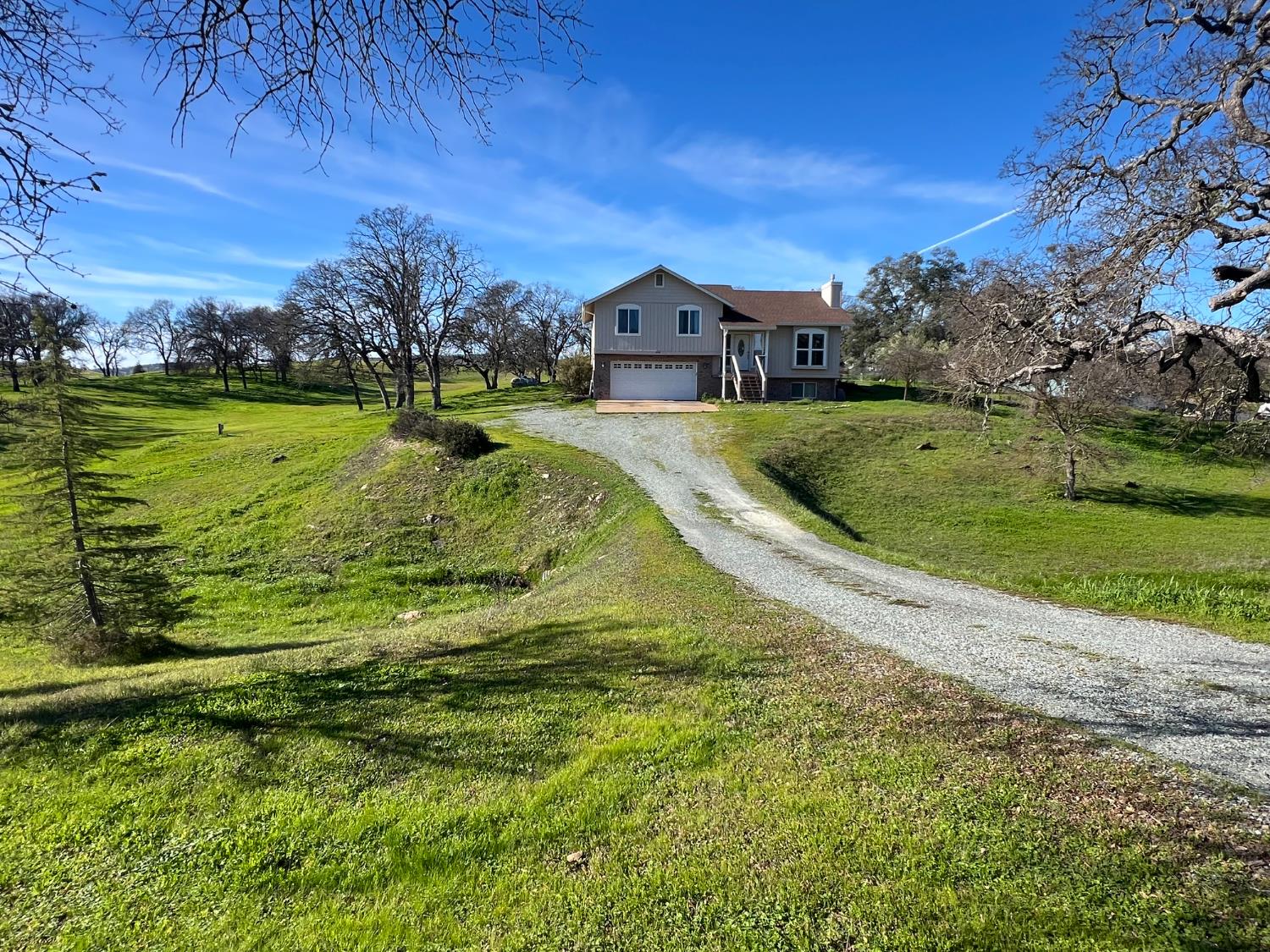 a aerial view of a house with a yard