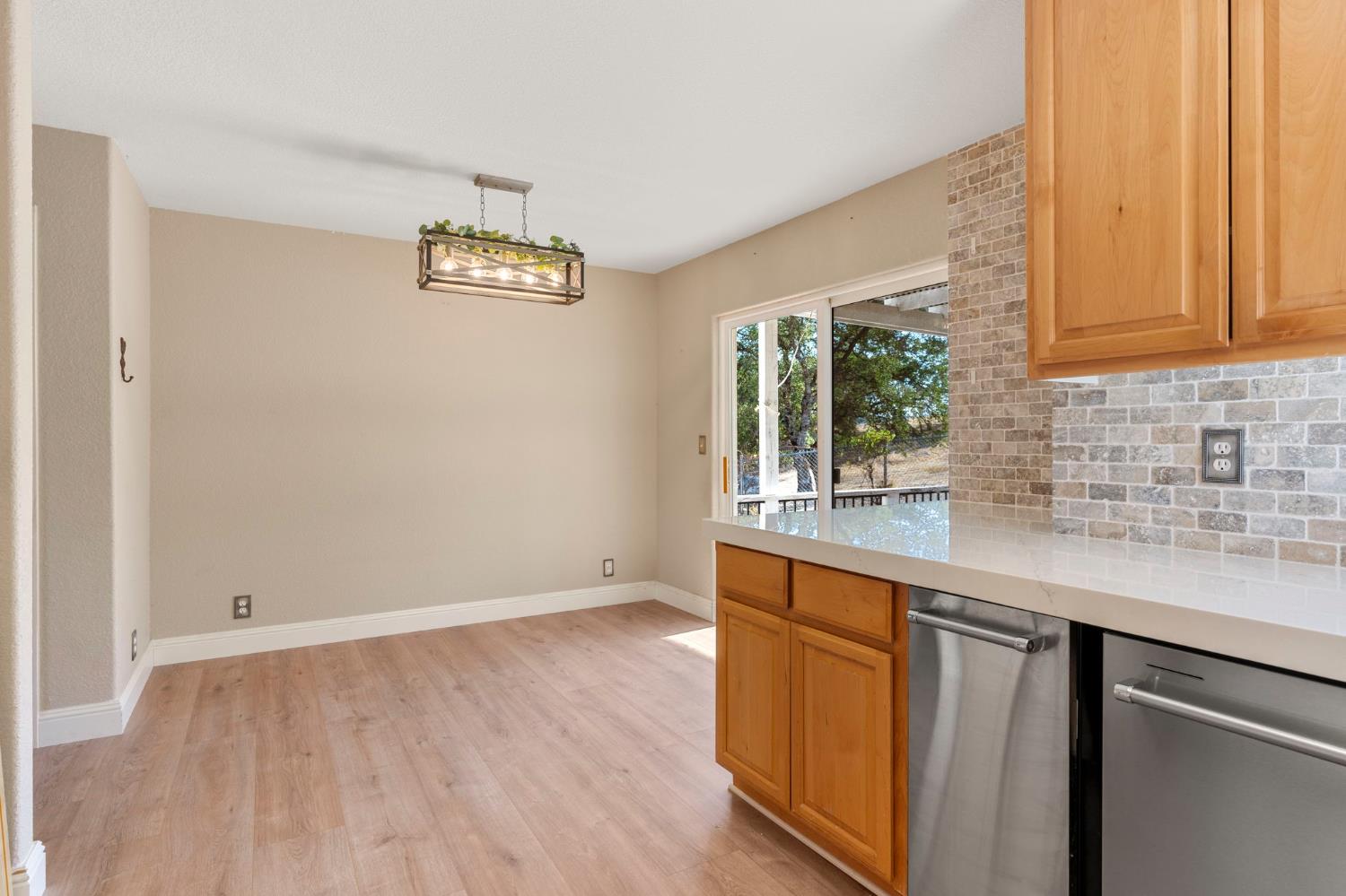 4068 Little John Road Copperopolis, CA 95228 - Photo 20 of 46 an empty room with wooden floor and window