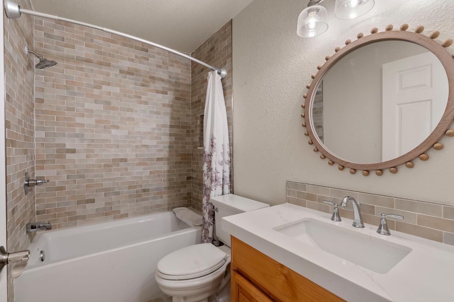 4068 Little John Road Copperopolis, CA 95228 - Photo 26 of 50 a bathroom with a sink a toilet and a mirror