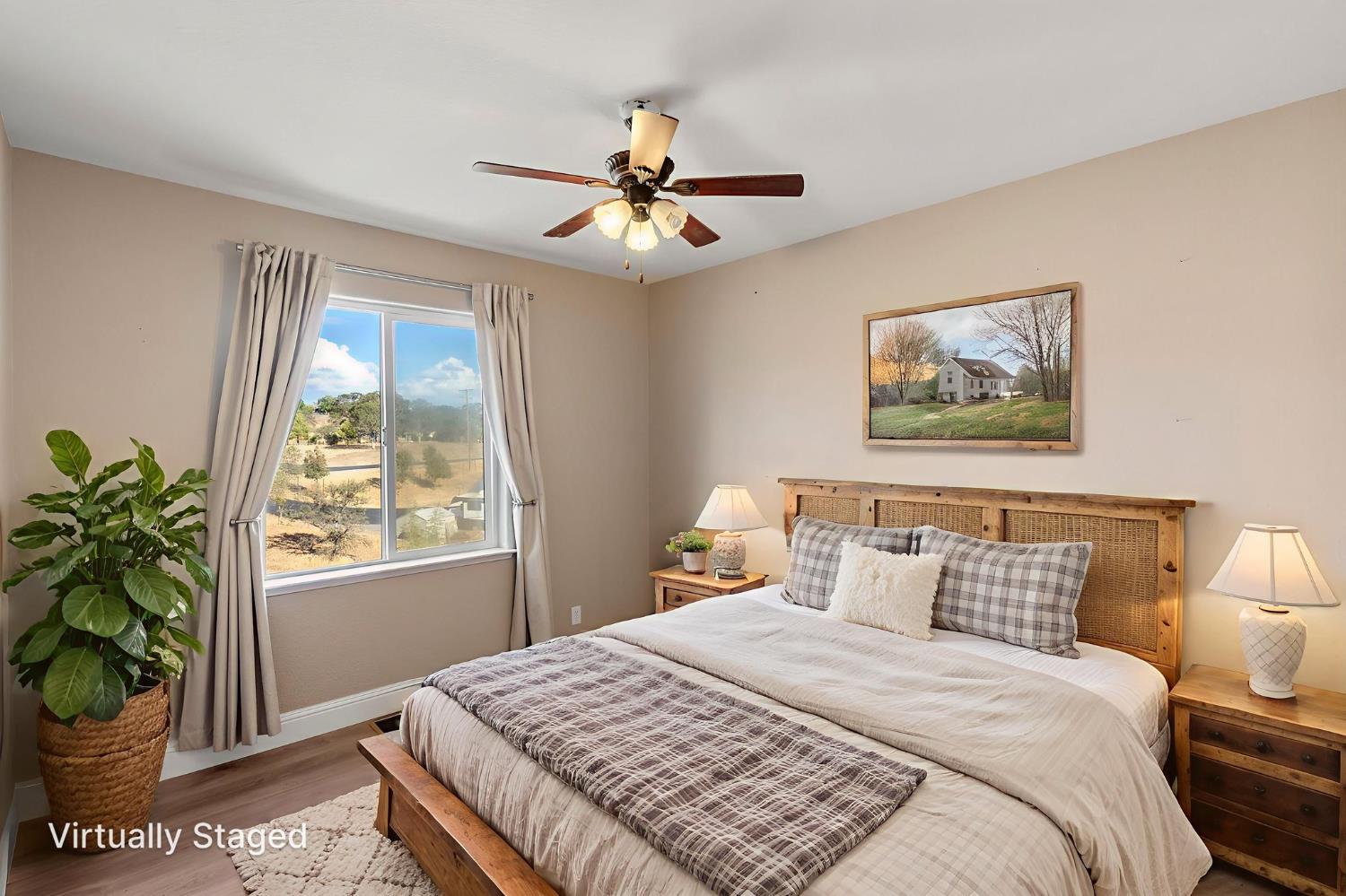 4068 Little John Road Copperopolis, CA 95228 - Photo 27 of 46 a bedroom with a large bed and a window