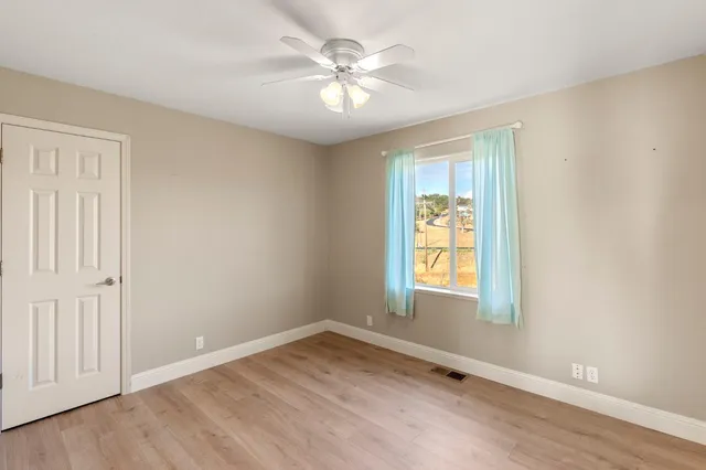 a balcony with table and chairs