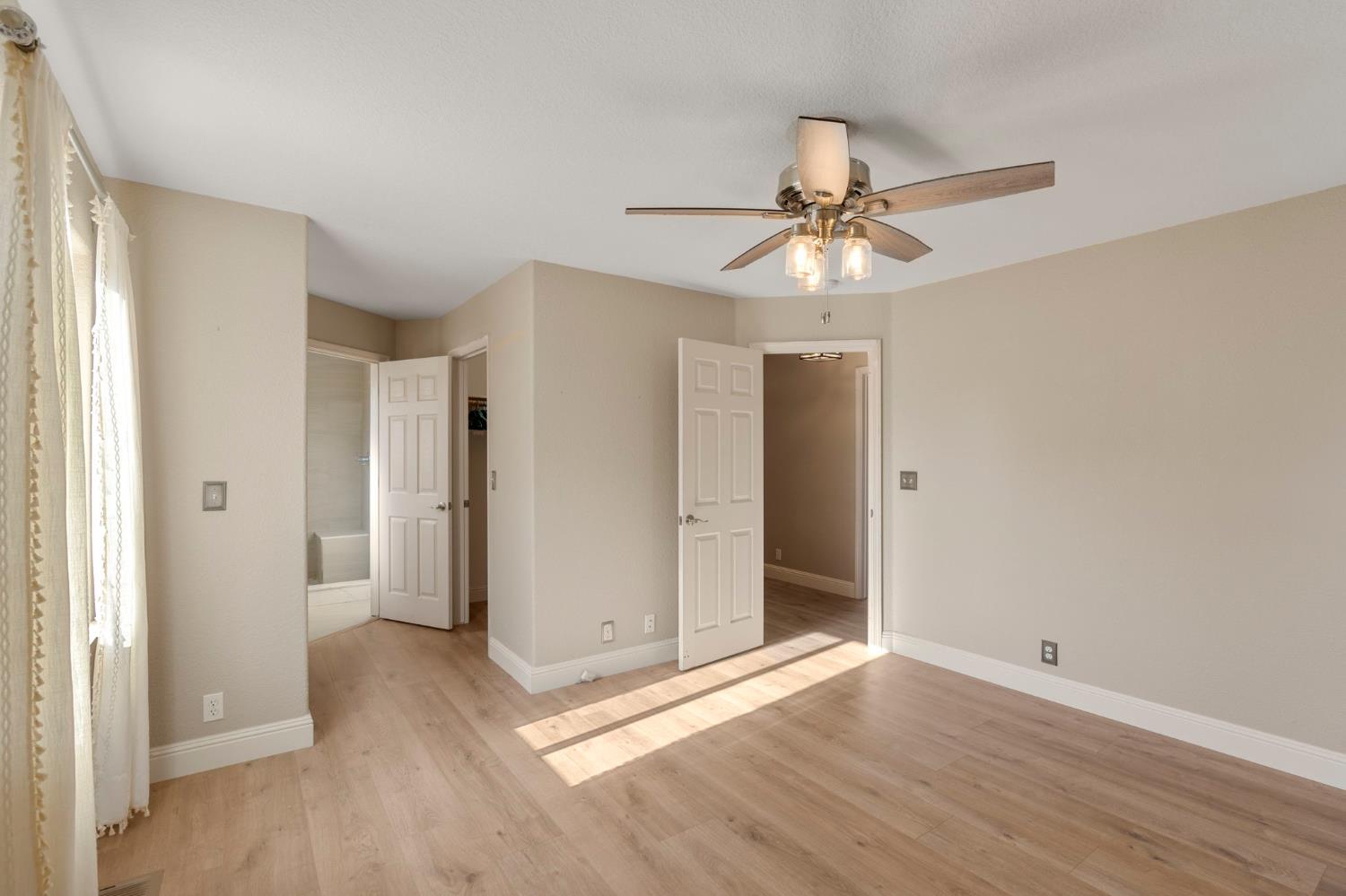 4068 Little John Road Copperopolis, CA 95228 - Photo 34 of 50 wooden floor in an empty room with a window