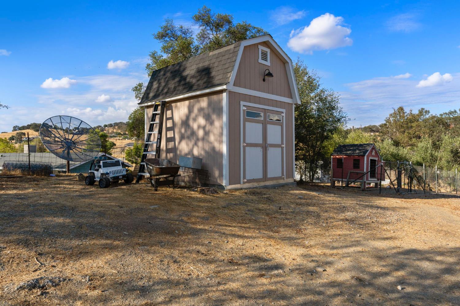 4068 Little John Road Copperopolis, CA 95228 - Photo 42 of 46 a front view of a house with a yard and garage