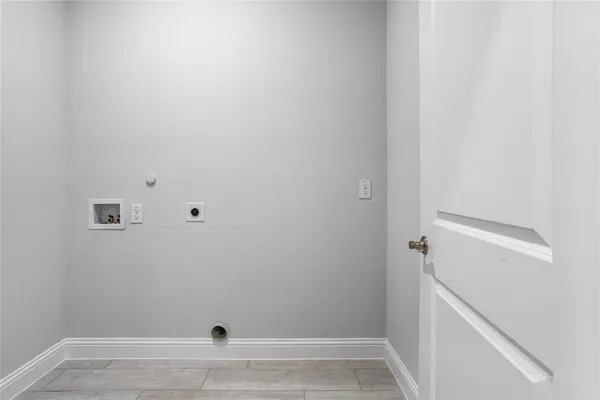 an empty room with projector & cabinets