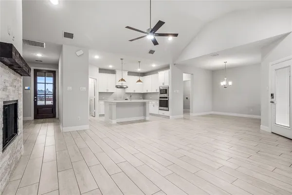 a view of a kitchen with a sink and a refrigerator