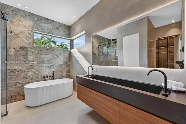 a bathroom with a bathtub and sink