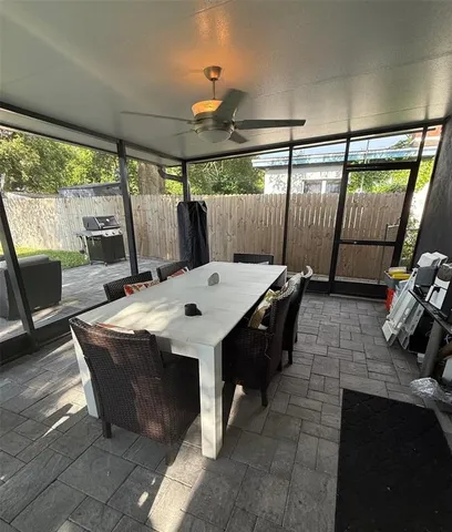 a view of a dining table with chairs in front of it