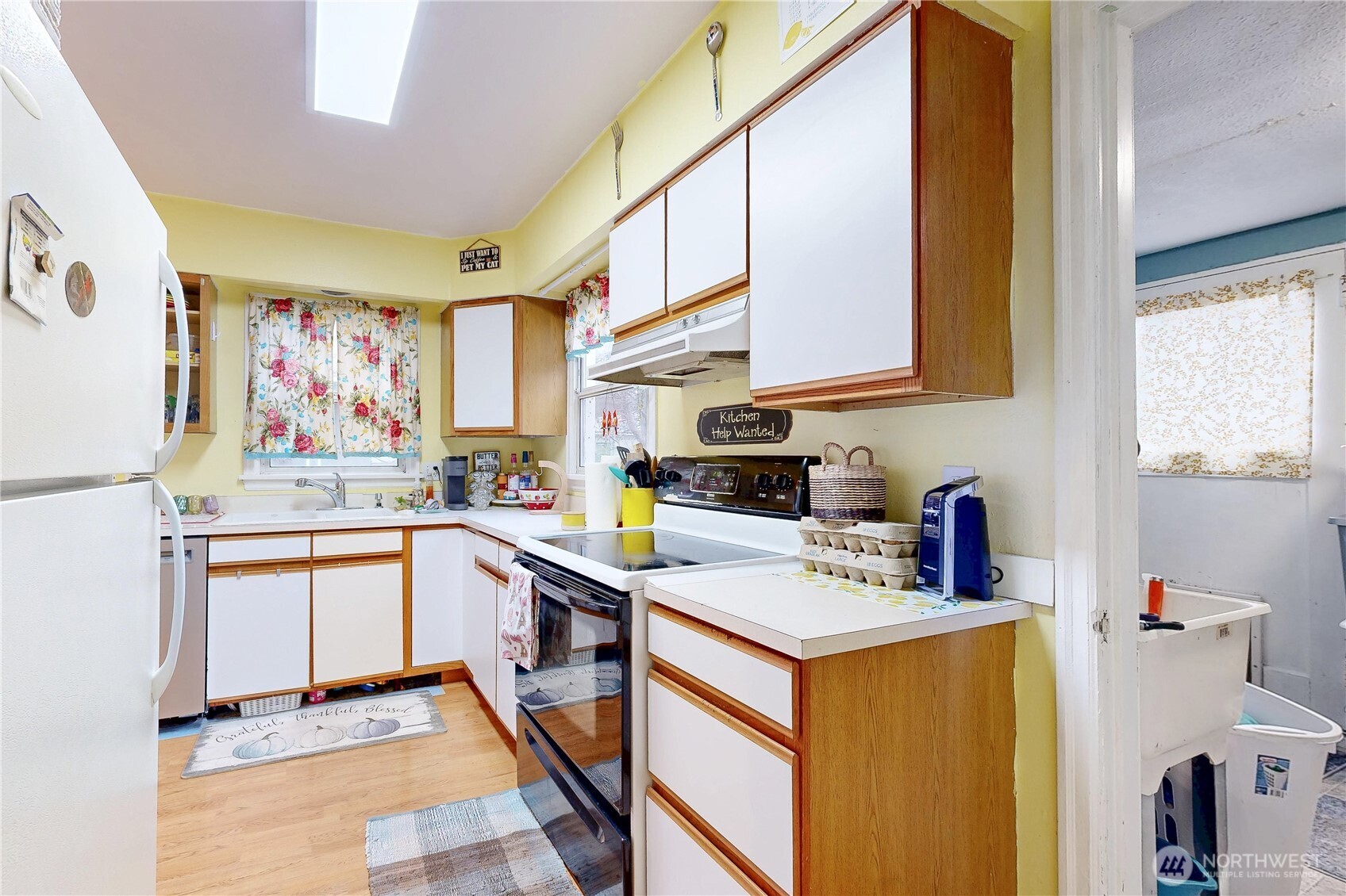 530 Southwest 4th Street College Place, WA 99324 - Photo 15 of 30 a kitchen with stainless steel appliances a stove a sink and a refrigerator